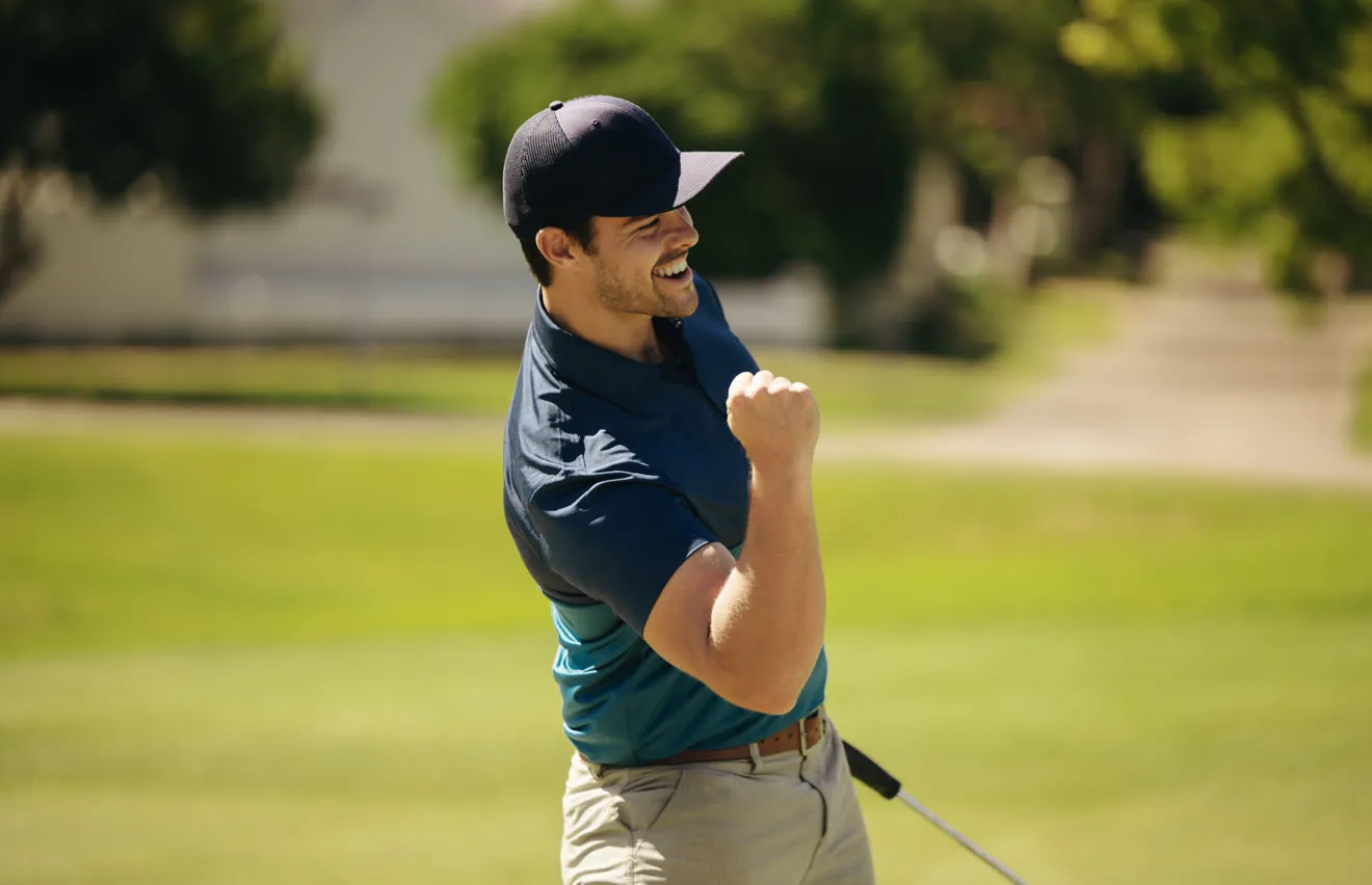Golfer pumping his fist after a great shot