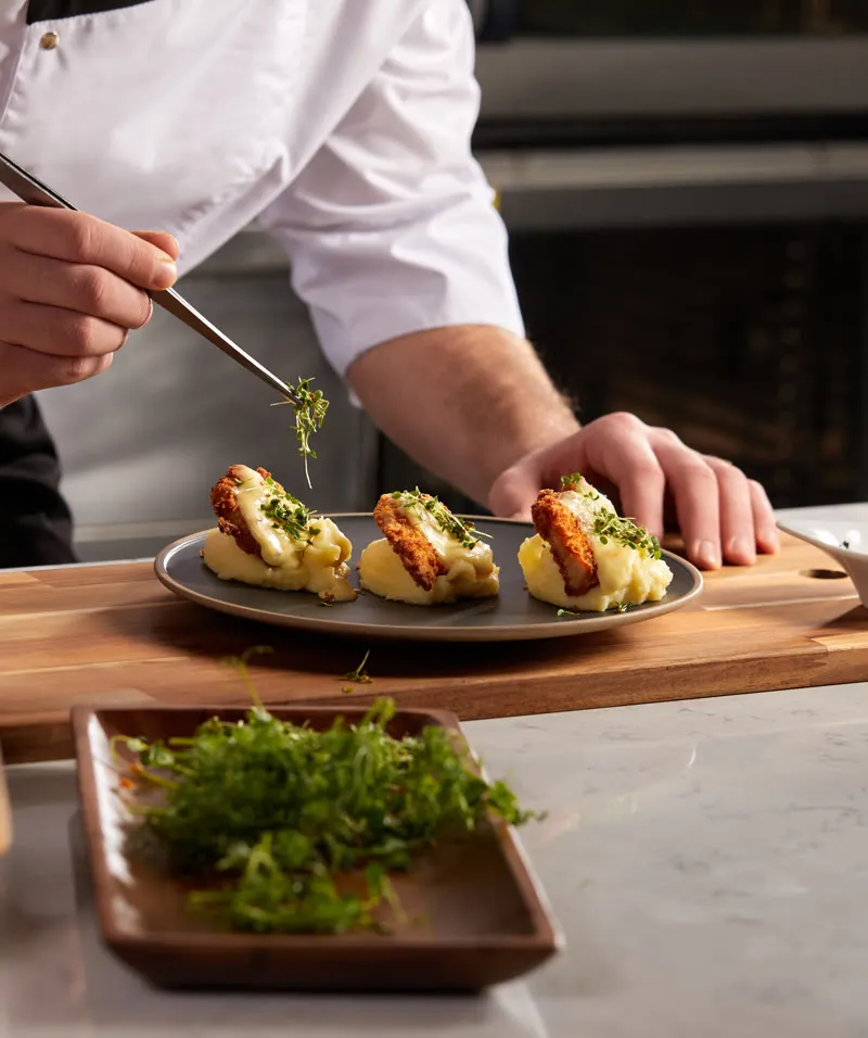 Chef plating small dishes