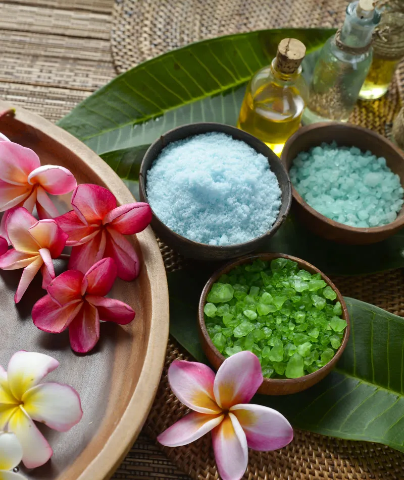 Spa salts, oils and frangipani flowers